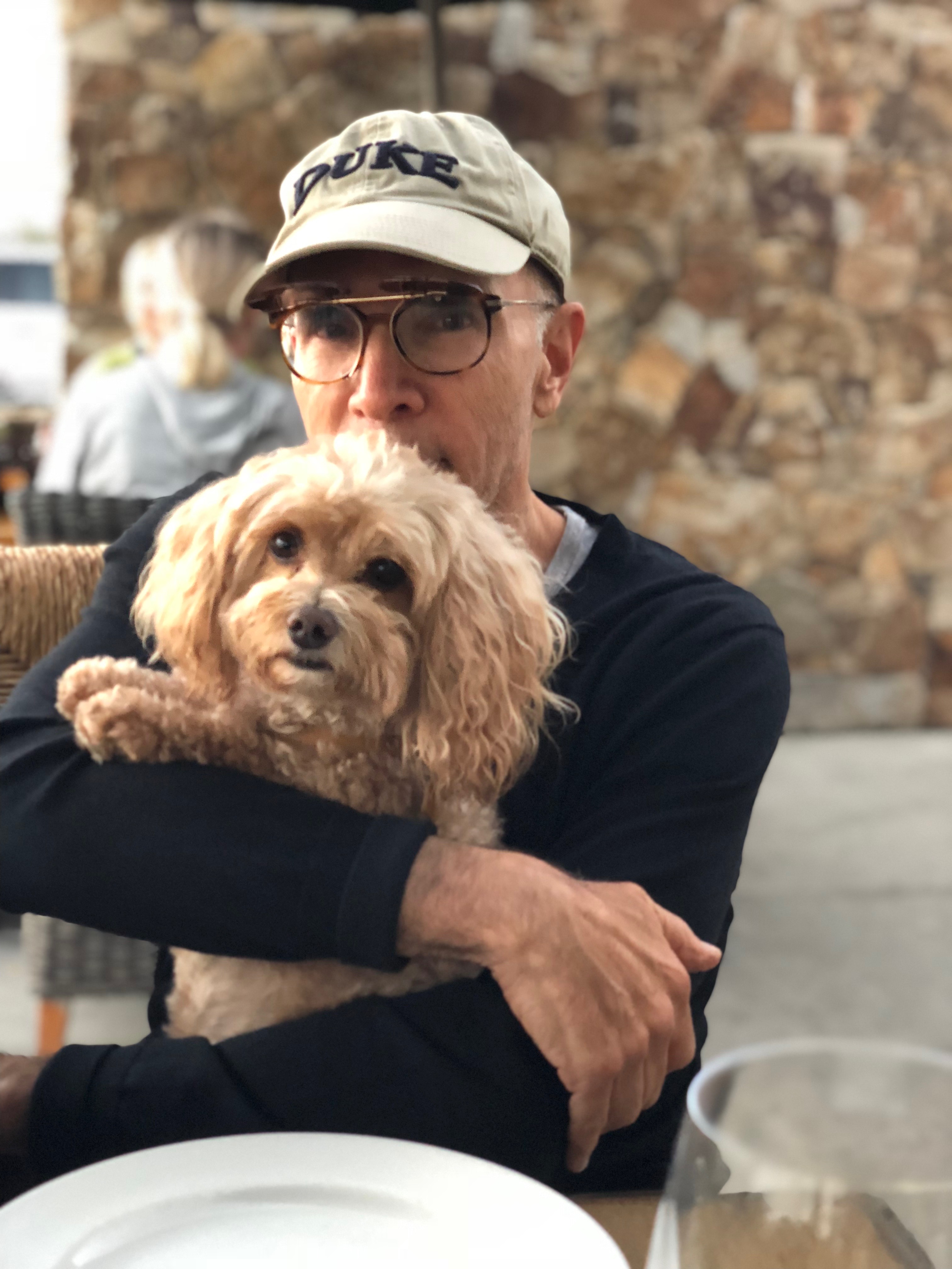 Dr. Tager holding his dog