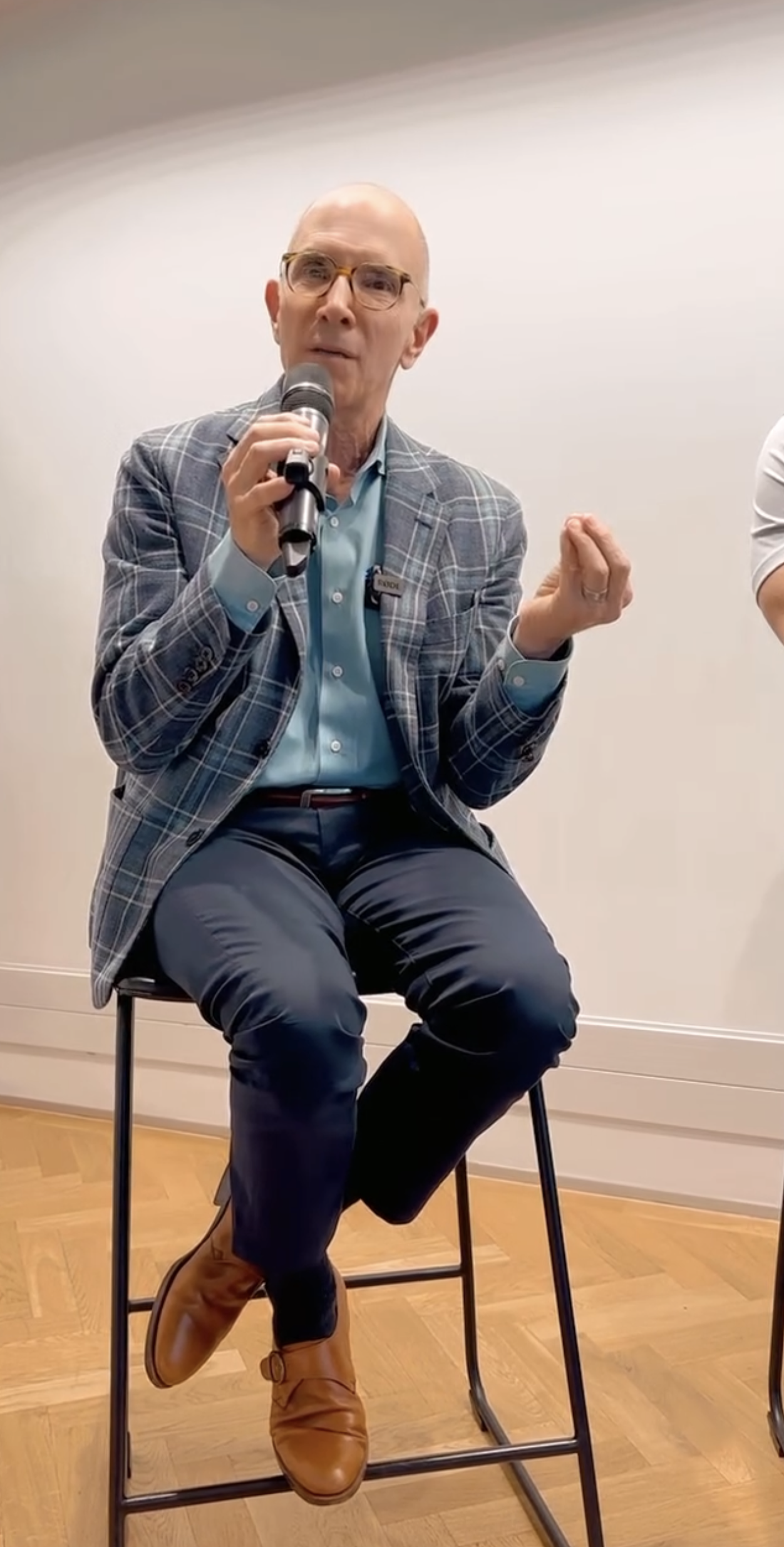 Dr. Tager speaking into a microphone
