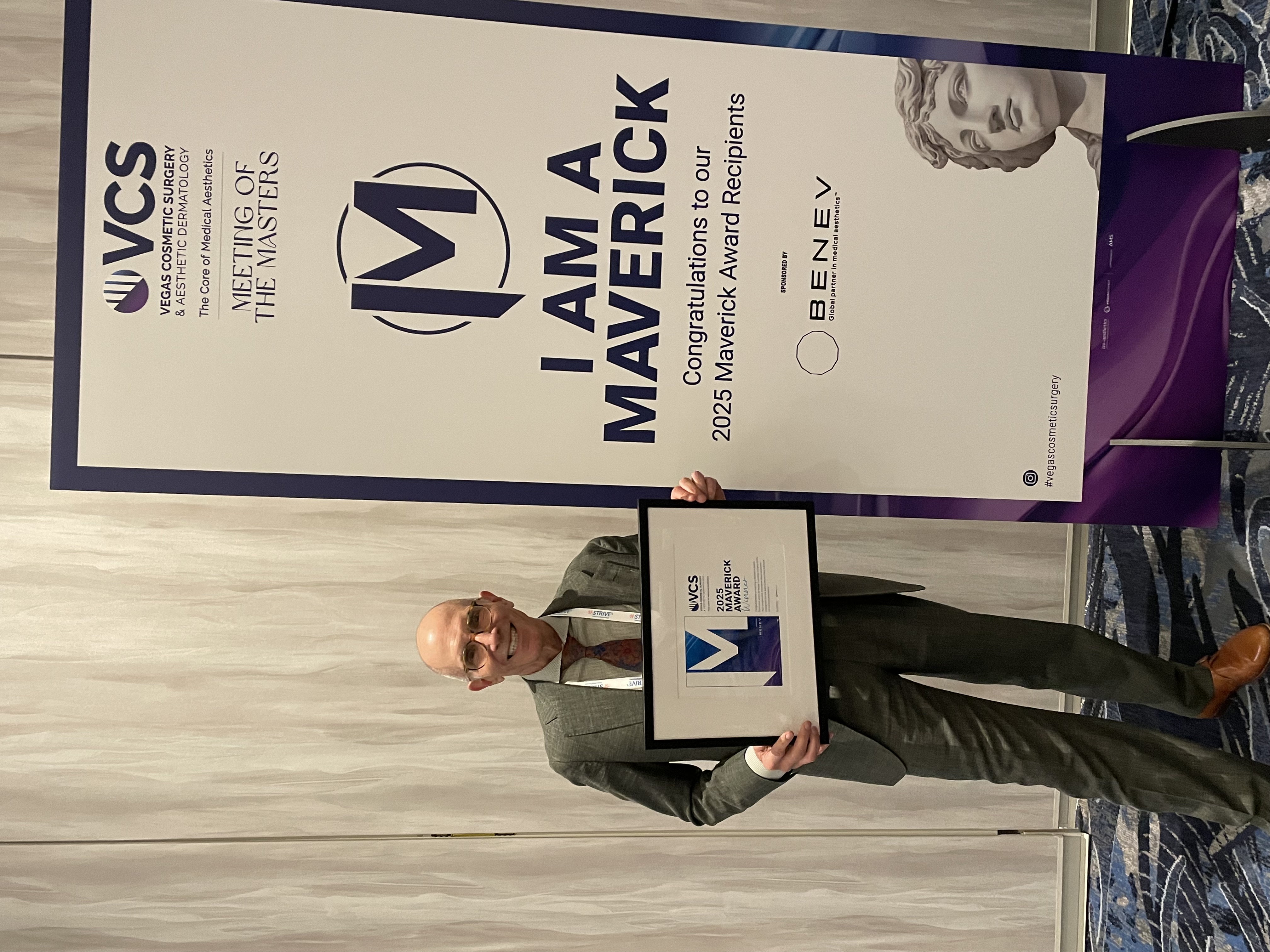 Dr. Mark Tager at a speaking award event