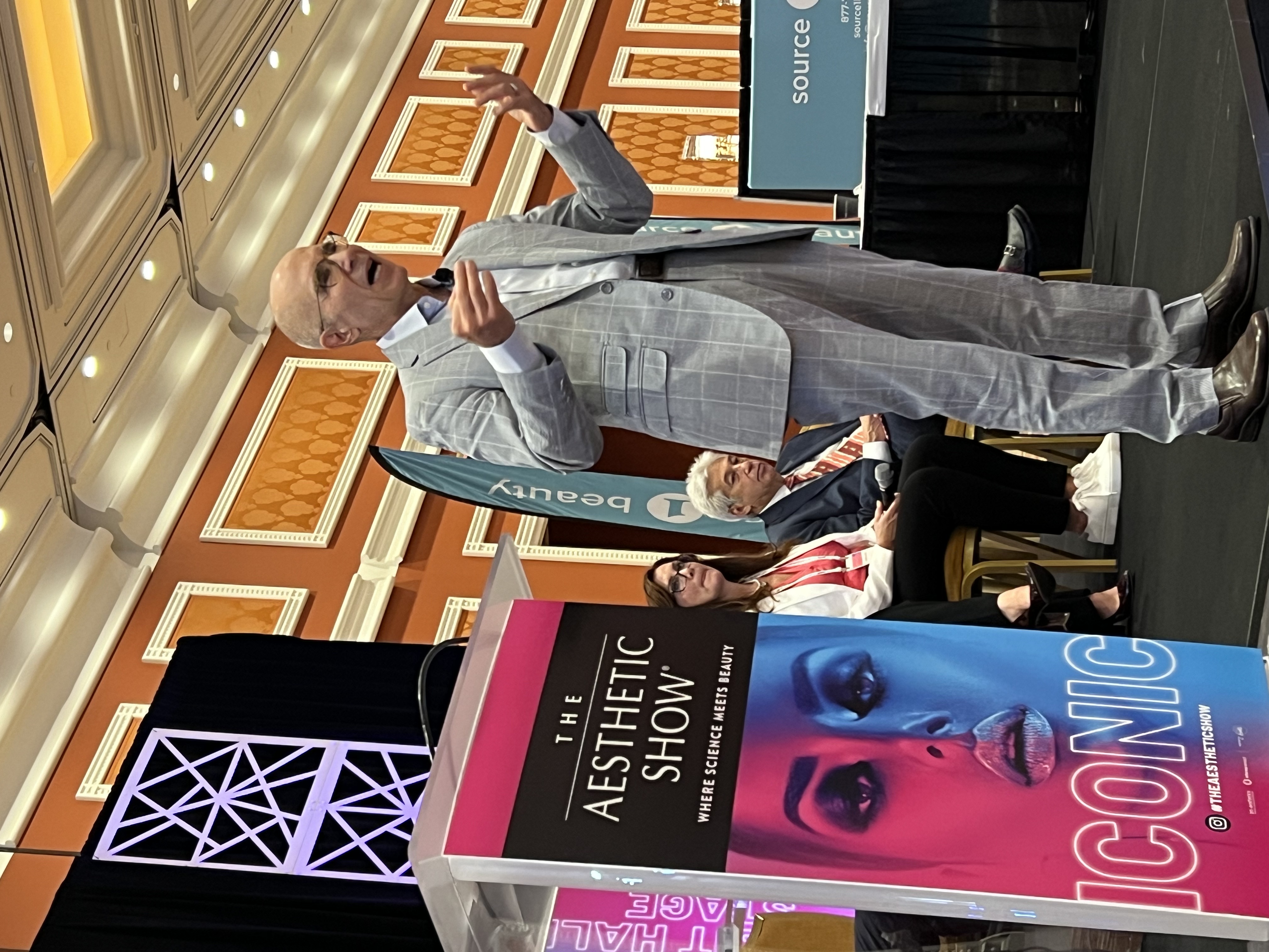 Dr. Mark Tager presenting on stage